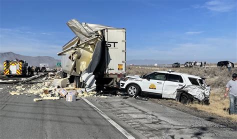 Several cars crash, semitruck drives into Tooele dealership building, catching fire, Main Street closed. . Semi truck crash tooele